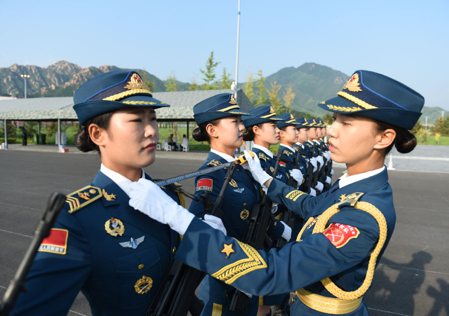 chinese girl dancing in military uniform